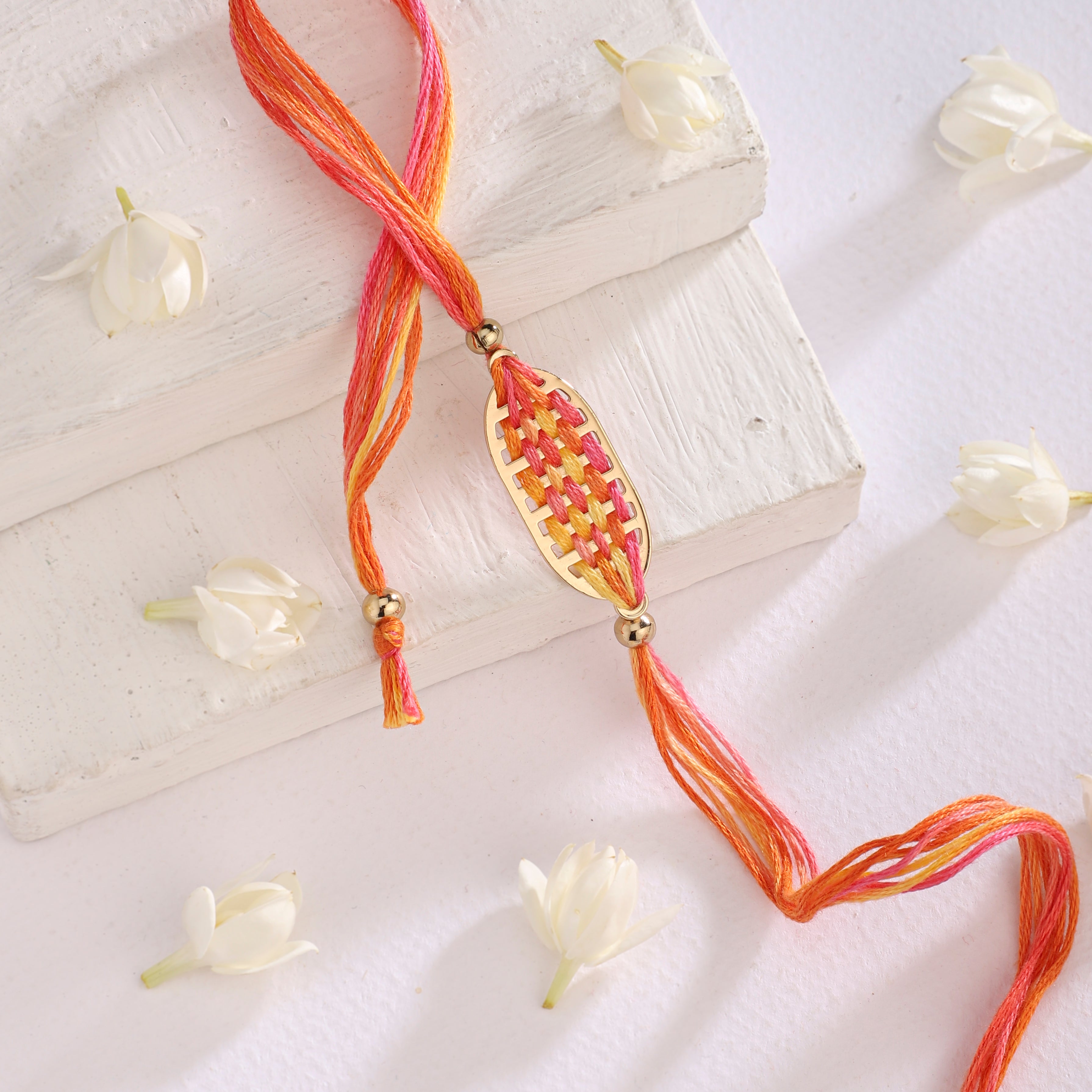 Rakhi Brass Woven - Orange | Anand Prakash