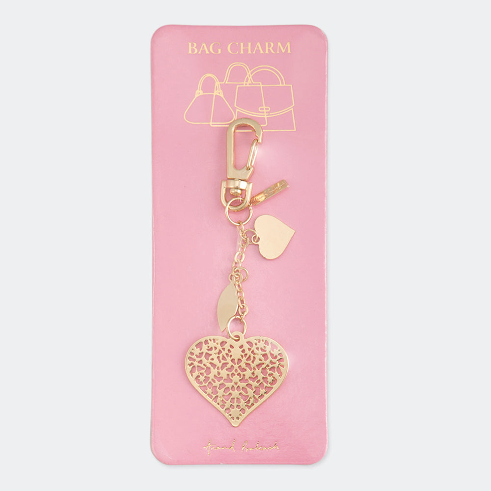 A gold-colored metal bag charm with a heart pattern, electroplated for a shiny finish, attached to a keychain ring. The charm is displayed on a dark background.