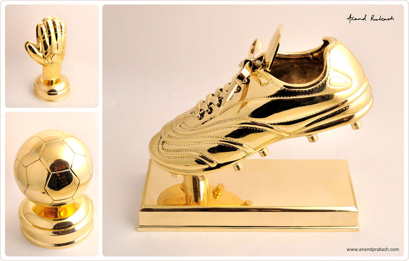 Golden boot, glove and football